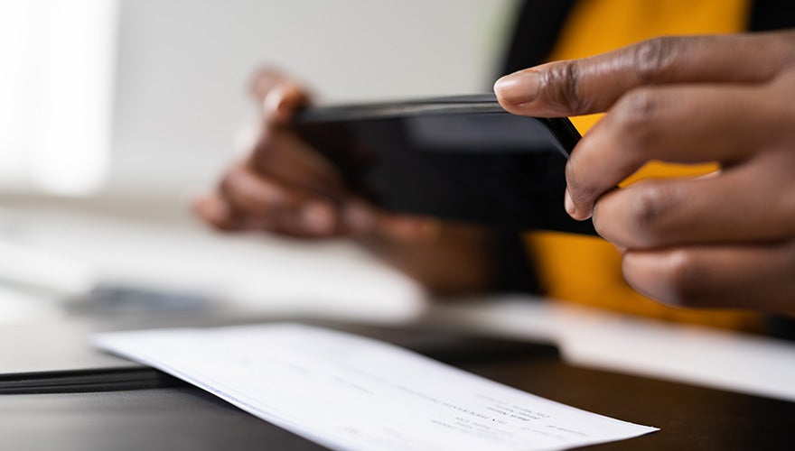 student checking mobile check deposit